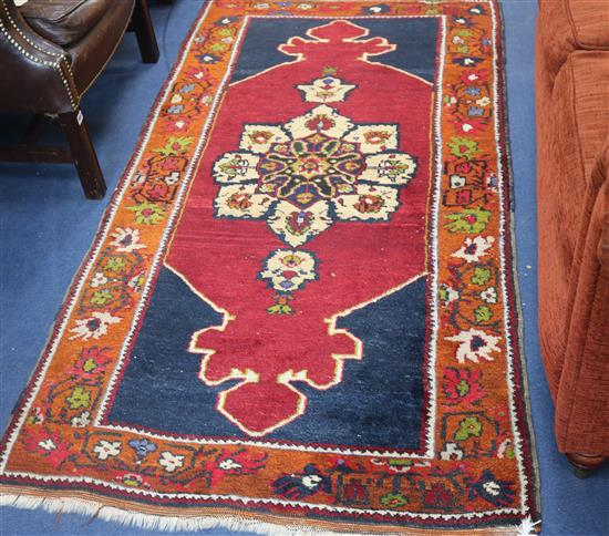 An Eastern rug, 190cm x 89cm